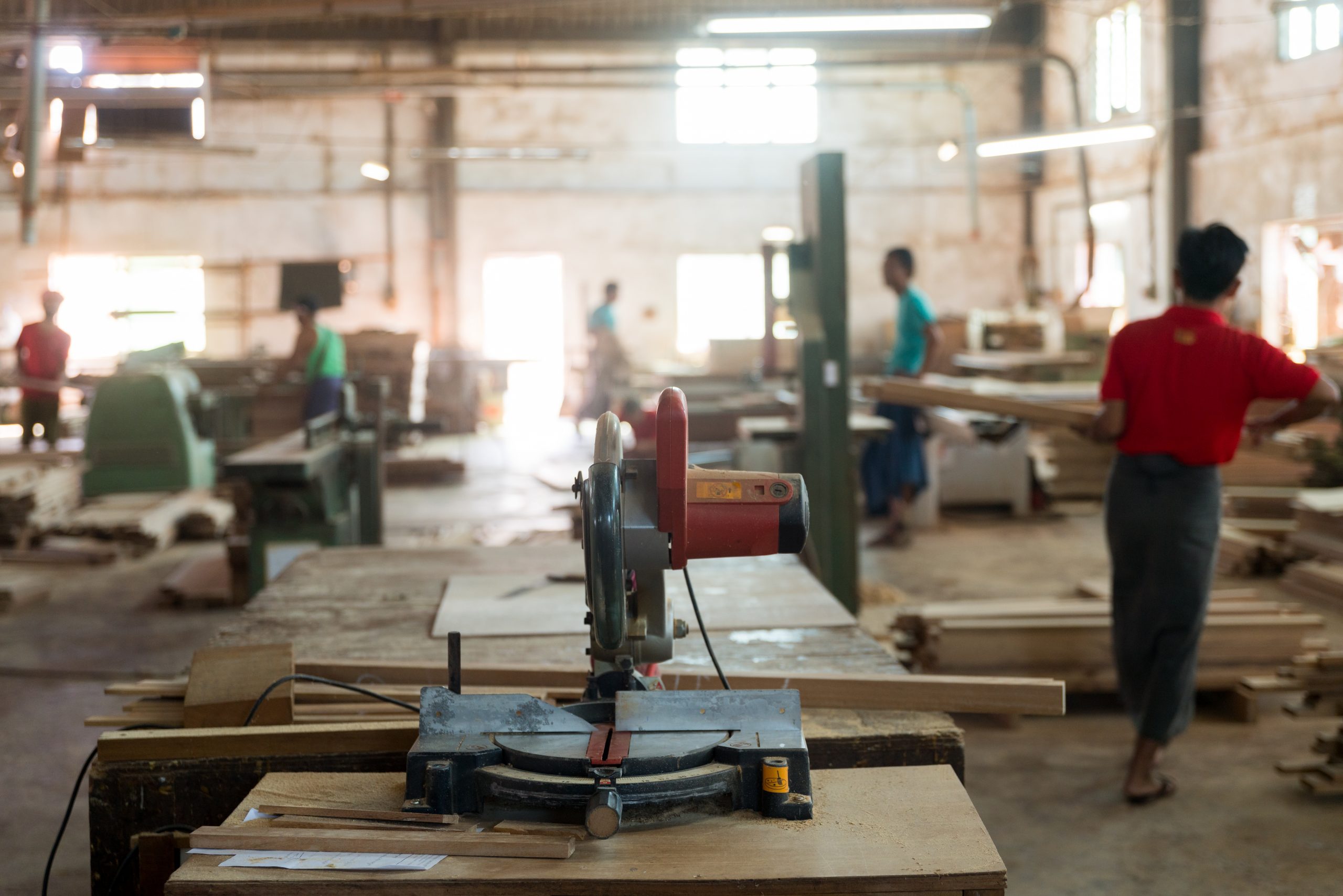 RANGOON, MYANMAR (BURMA) - May 14, 2019: A close shot of a wood cutting machine in a factory with a blurred background